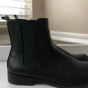 black Chelsea boots.